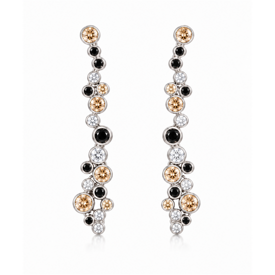 A pair of long, dangling earrings with a cluster design featuring round black, white, and champagne-colored gemstones in a silver-tone setting, shown against a plain white background.