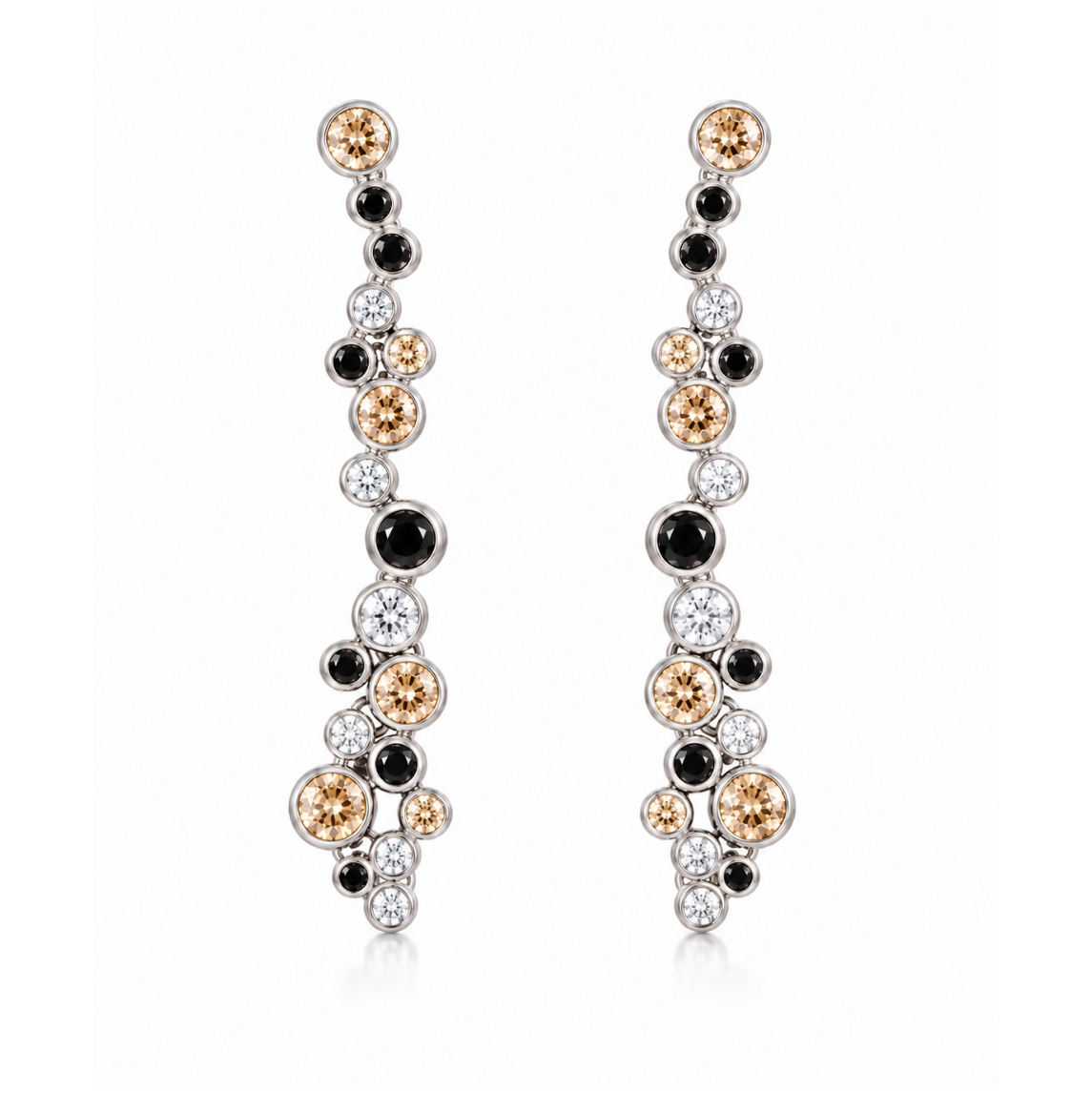 A pair of long, dangling earrings with a cluster design featuring round black, white, and champagne-colored gemstones in a silver-tone setting, shown against a plain white background.