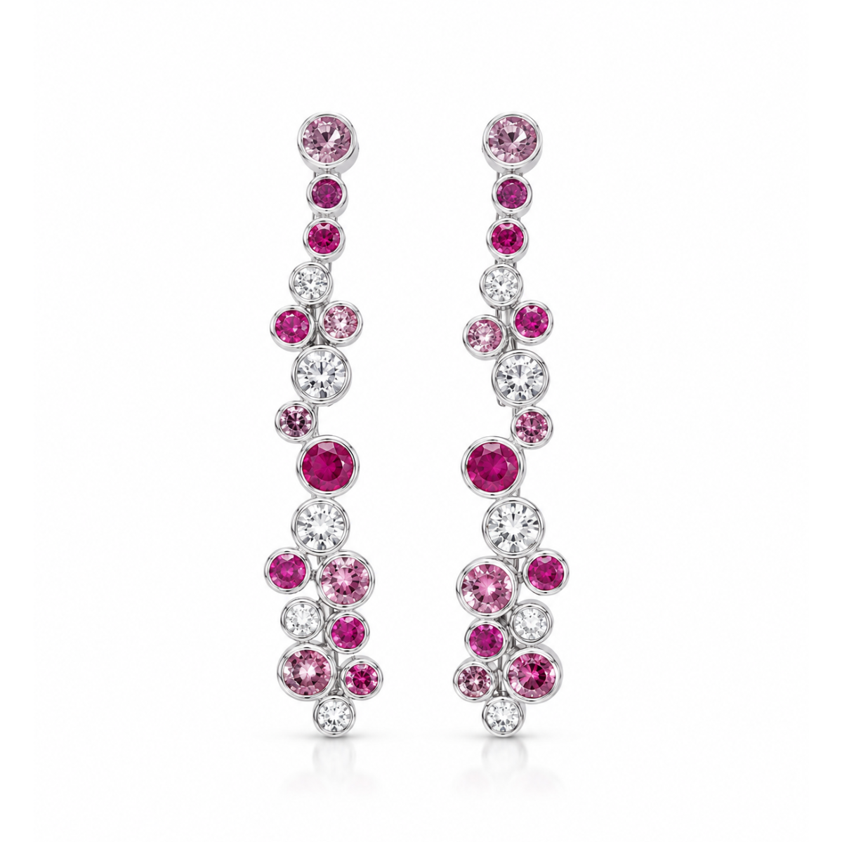 A pair of silver-tone drop earrings adorned with pink and clear round-cut gemstones, arranged in a cascading floral pattern on a solid white background.
