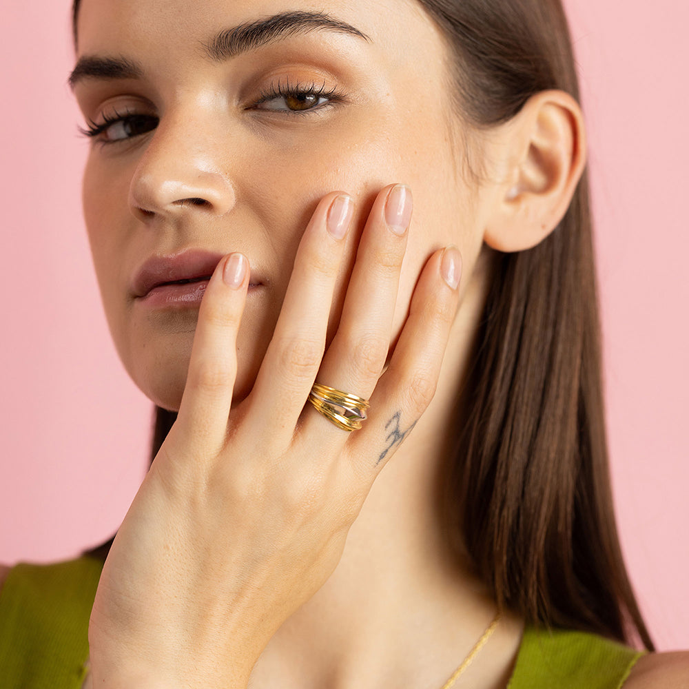 Dual-tone gold and rhodium signet band ring in 925 silver, bold everyday luxury — model - close-up shot.