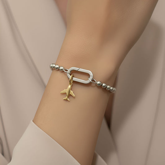 Gold-plated 925 silver charm from the Enishi collection, symbolizing friendship and connection — model - close-up shot.