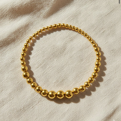 Gold-plated 925 silver bracelet from the Enishi collection, vibrant and symbolic of connection — flat lay shot.