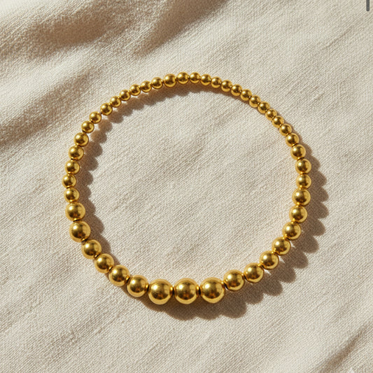Gold-plated 925 silver bracelet from the Enishi collection, vibrant and symbolic of connection — flat lay shot.