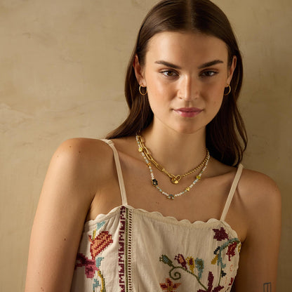 Gold-plated 925 silver heart lock from the Enishi collection, symbolizing love and unity — model - full look shot.