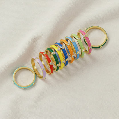 Gold-plated 925 silver multi-colour bands from the Enishi collection, celebrating unity and individuality — flat lay shot.