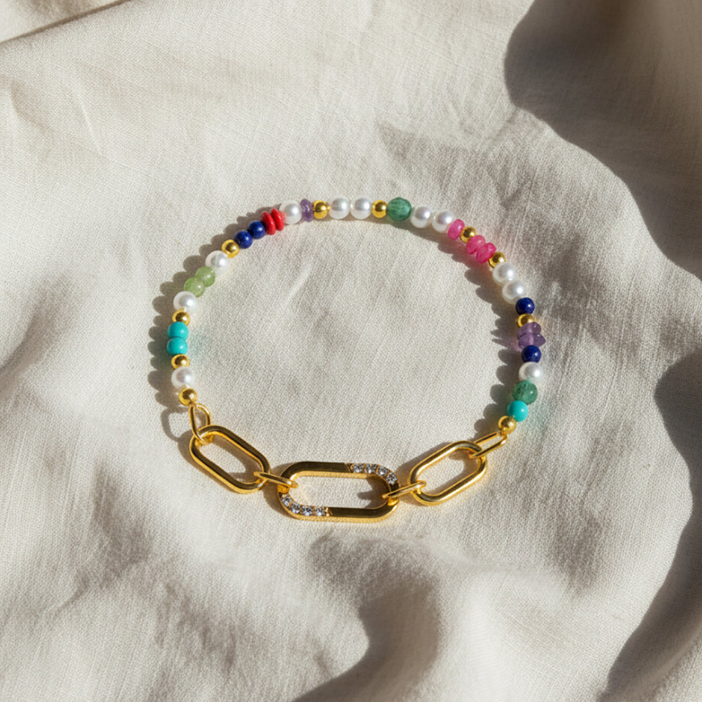 Gold-plated 925 silver bracelet from the Enishi collection, vibrant and symbolic of connection — flat lay shot.
