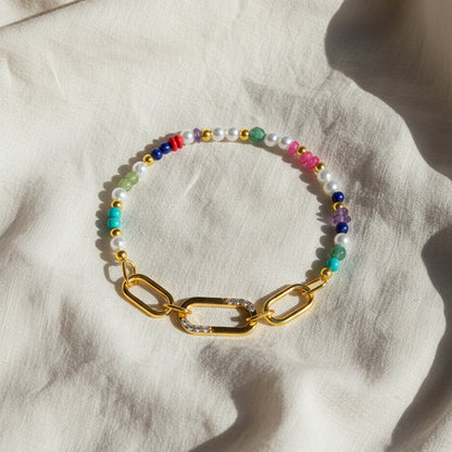 Gold-plated 925 silver bracelet from the Enishi collection, vibrant and symbolic of connection — flat lay shot.
