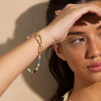 Gold-plated 925 silver bracelet from the Enishi collection, vibrant and symbolic of connection — model - close-up shot.