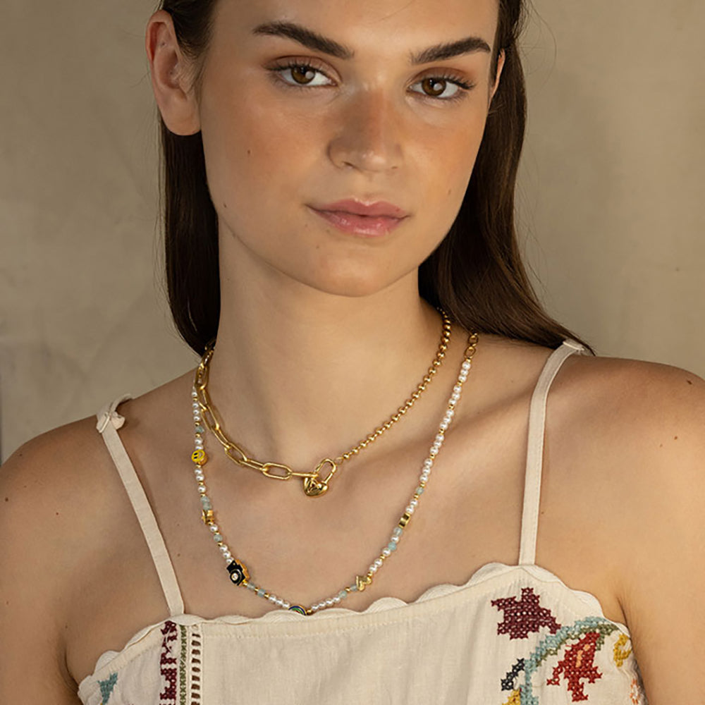 Gold-plated 925 silver necklace from the Enishi collection, colourful and modern — model - close-up shot.