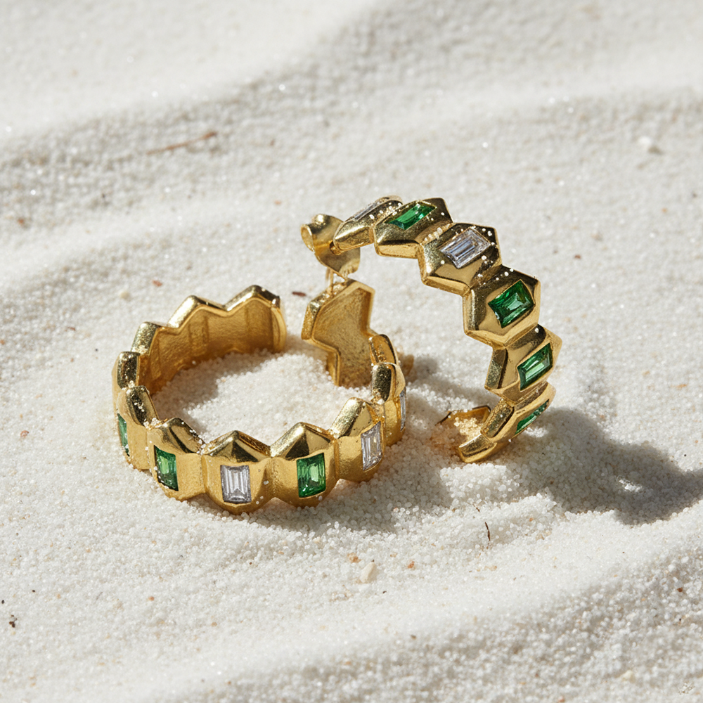 Flat Lay of KiraKira Hoops | Gold-Plated Jewellery with Emeralds from Nishani’s Kira Kira festive collection — handcrafted emerald jewelry, earrings in gold-plated 925 silver.