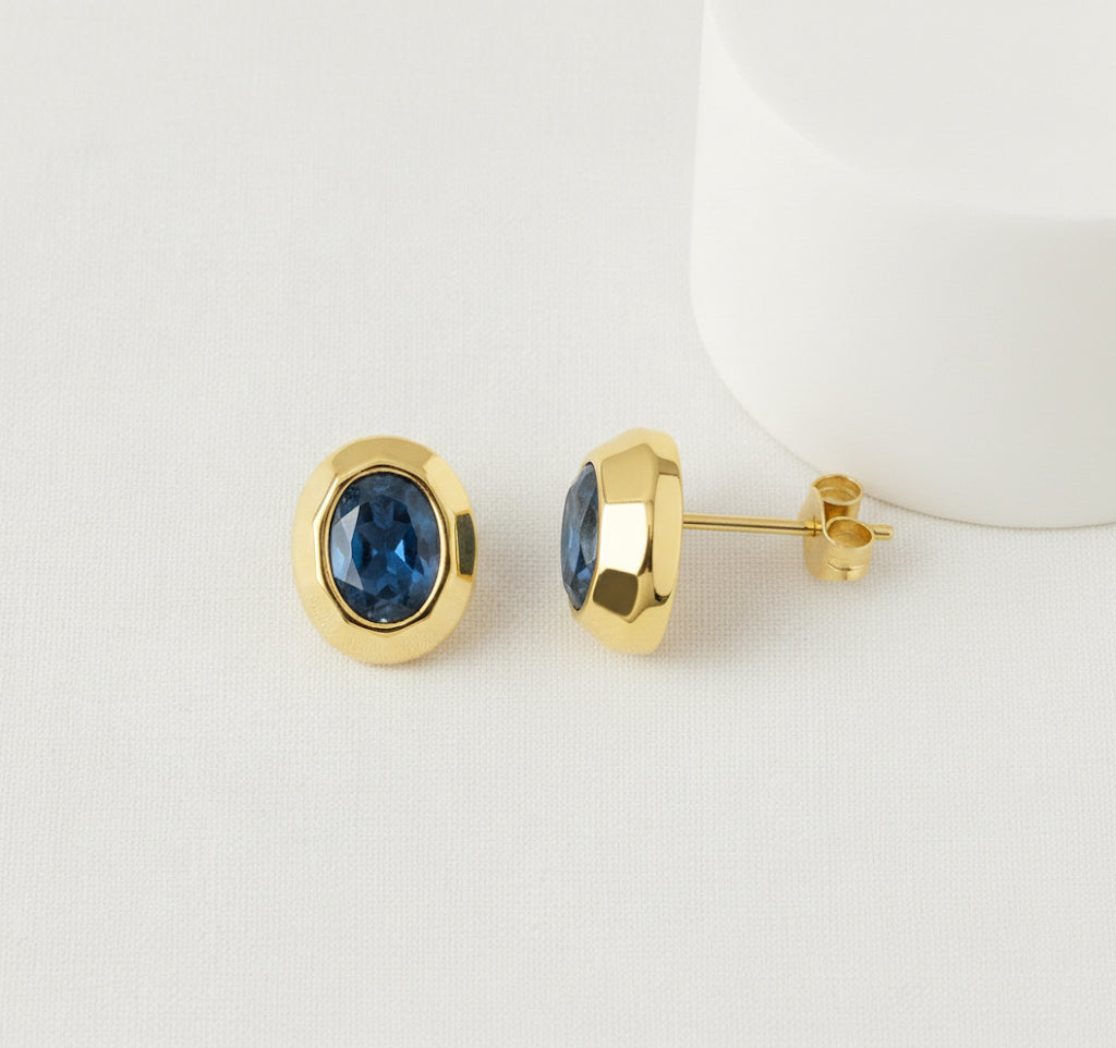 Flat Lay of KiraKira Sapphire Stud Earrings | 925 Silver Gold-Plated from Nishani’s Kira Kira festive collection — handcrafted sapphire jewelry, earrings in gold-plated 925 silver.