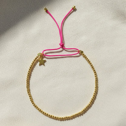 Flat Lay of Ukiyo Beaded Thread Bracelet — a minimal, gold-plated 925 silver design crafted for everyday wear from Nishani’s Ukiyo collection.