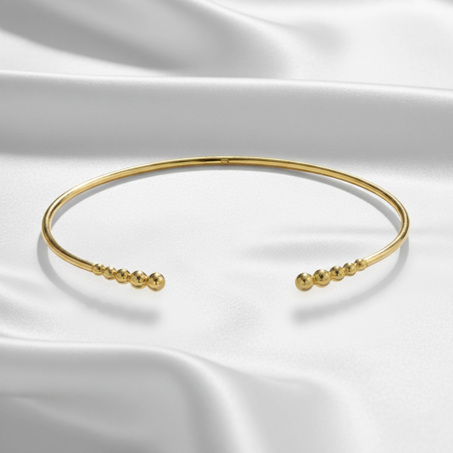 Flat Lay of Ukiyo Open Bangle — a minimal, gold-plated 925 silver design crafted for everyday wear from Nishani’s Ukiyo collection.