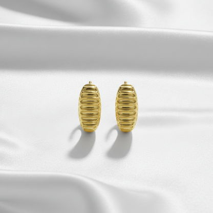 Flat Lay of Ukiyo Ridges Huggies — a minimal, gold-plated 925 silver design crafted for everyday wear from Nishani’s Ukiyo collection.