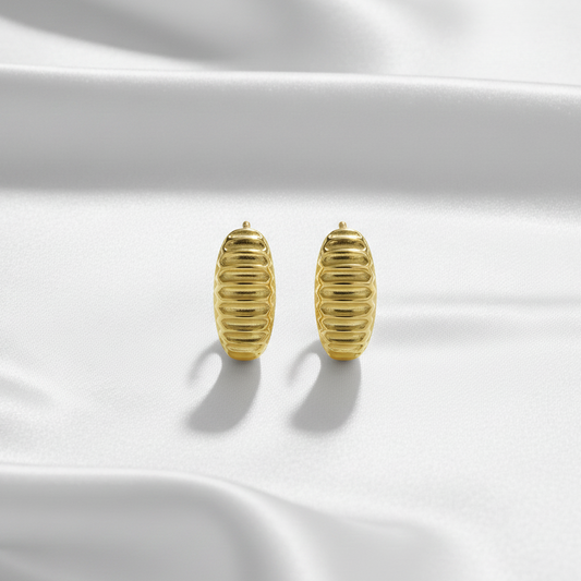 Flat Lay of Ukiyo Ridges Huggies — a minimal, gold-plated 925 silver design crafted for everyday wear from Nishani’s Ukiyo collection.