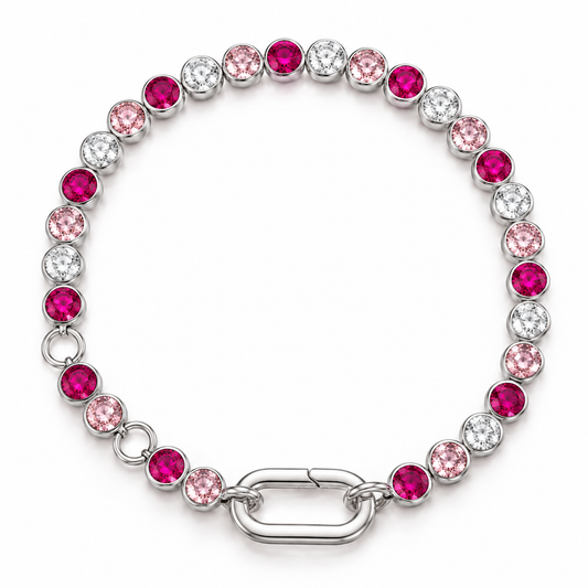 A silver link bracelet featuring alternating round pink and clear crystals in bezel settings, with a polished silver clasp, shown on a white background.