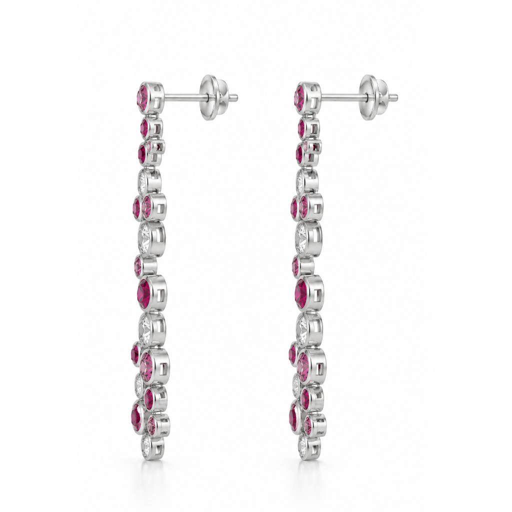 A pair of silver-toned drop earrings featuring a vertical line of round-cut pink gemstones and clear stones, shown against a plain white background.