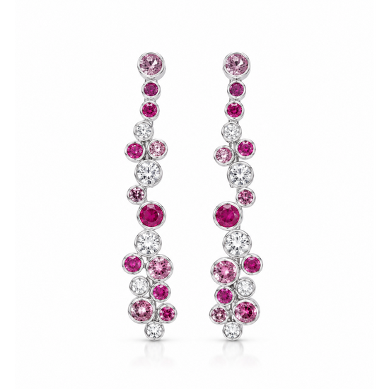 A pair of silver-tone drop earrings adorned with pink and clear round-cut gemstones, arranged in a cascading floral pattern on a solid white background.