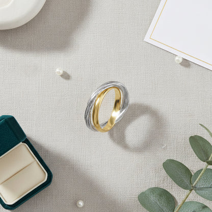 Gold and rhodium interlinked ring in 925 silver, fluid dual-tone statement piece — flat lay shot.