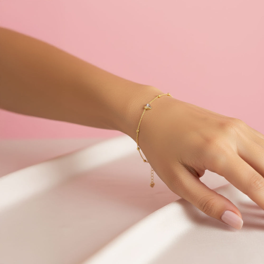 Gold and rhodium organic heart bracelet in 925 silver, sculptural and romantic — model - close-up shot.