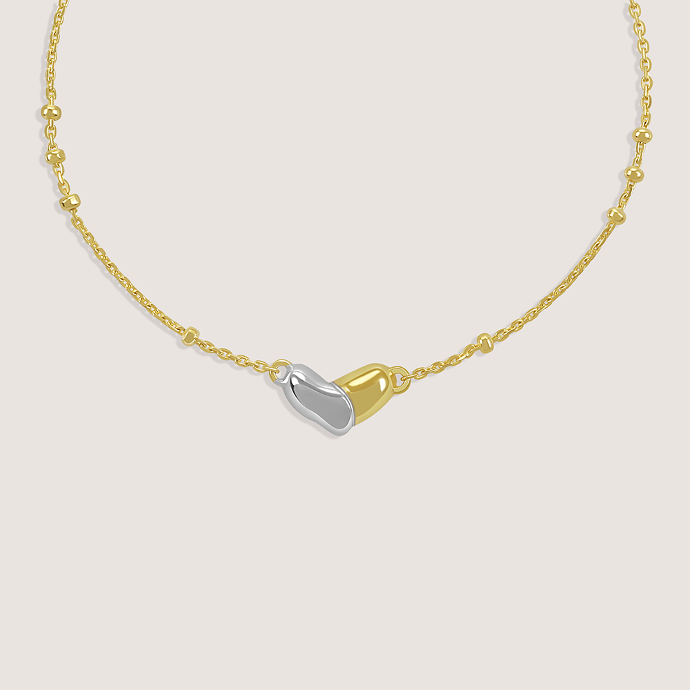Gold and rhodium organic heart bracelet in 925 silver, sculptural and romantic — product - side shot.