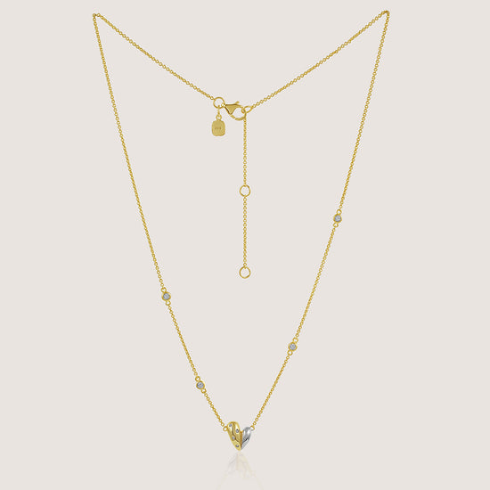 Gold and rhodium organic heart necklace in 925 silver, statement sculptural pendant — product - front shot.