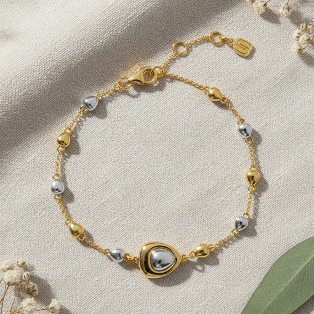 Gold and rhodium puffed bracelet in 925 silver, statement dual-tone wristwear — flat lay shot.