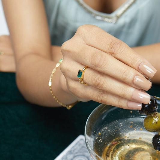 Model Image 1 of KiraKira Emerald Ring | 925 Silver Gold-Plated from Nishani’s Kira Kira festive collection — handcrafted emerald jewelry, ring in gold-plated 925 silver.