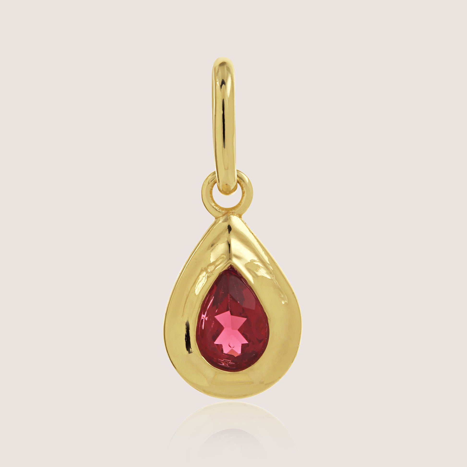 White Background - Front of KiraKira Ruby Charm 925 Silver Gold-Plated from Nishani’s Kira Kira festive collection handcrafted ruby jewelry, charm in gold-plated 925 silver.
