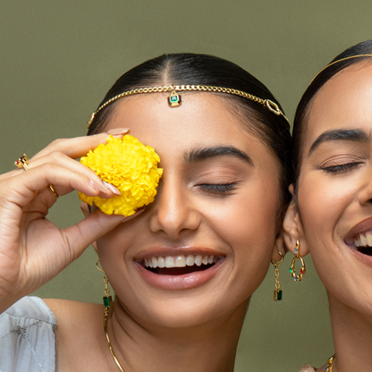 Model Image 1 of KiraKira Emerald Charm | 925 Silver Gold-Plated from Nishani’s Kira Kira festive collection — handcrafted emerald jewelry, charm in gold-plated 925 silver.