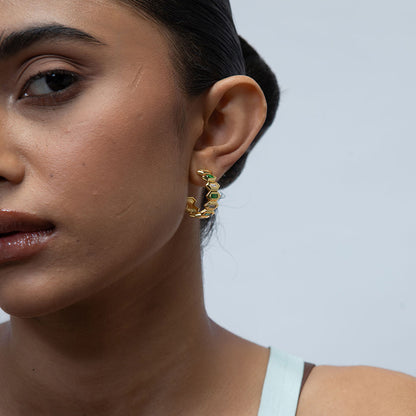 Model Image 1 of KiraKira Hoops | Gold-Plated Jewellery with Emeralds from Nishani’s Kira Kira festive collection — handcrafted emerald jewelry, earrings in gold-plated 925 silver.