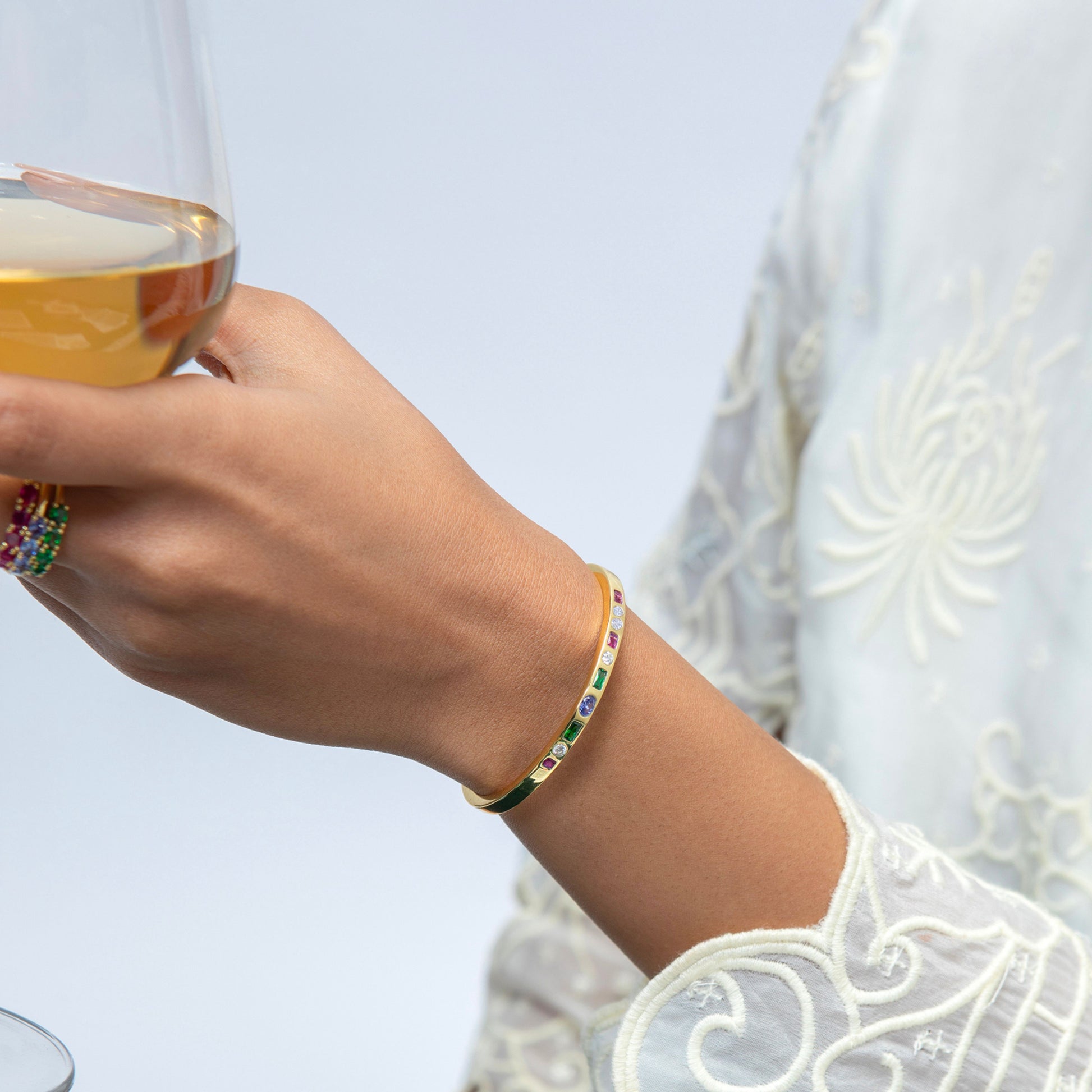 Model Image 1 of KiraKira Multi-Colour Cuff | 925 Silver Gold-Plated CZ from Nishani’s Kira Kira festive collection — handcrafted multicolour stones jewelry, bracelet in gold-plated 925 silver.