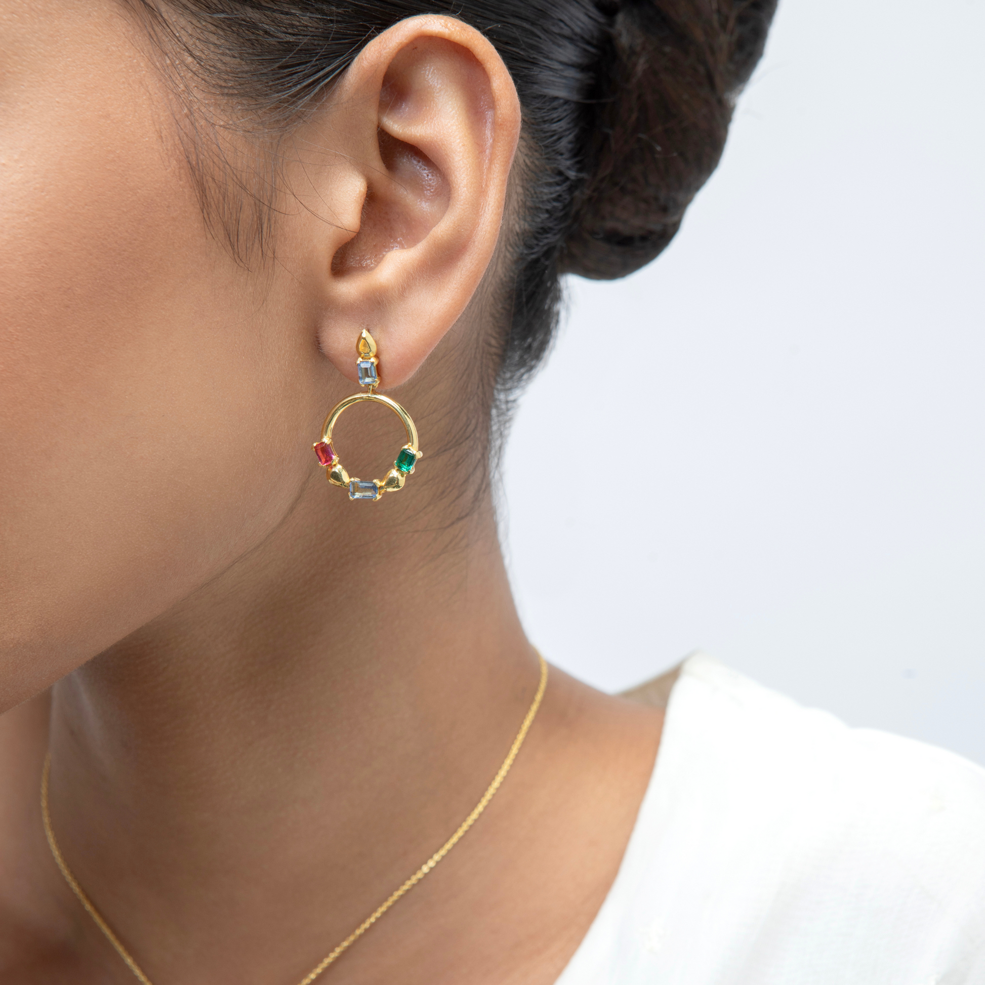 Model Image 1 of KiraKira Multi-Colour Danglers | 925 Silver Gold-Plated from Nishani’s Kira Kira festive collection — handcrafted multicolour stones jewelry, earrings in gold-plated 925 silver.