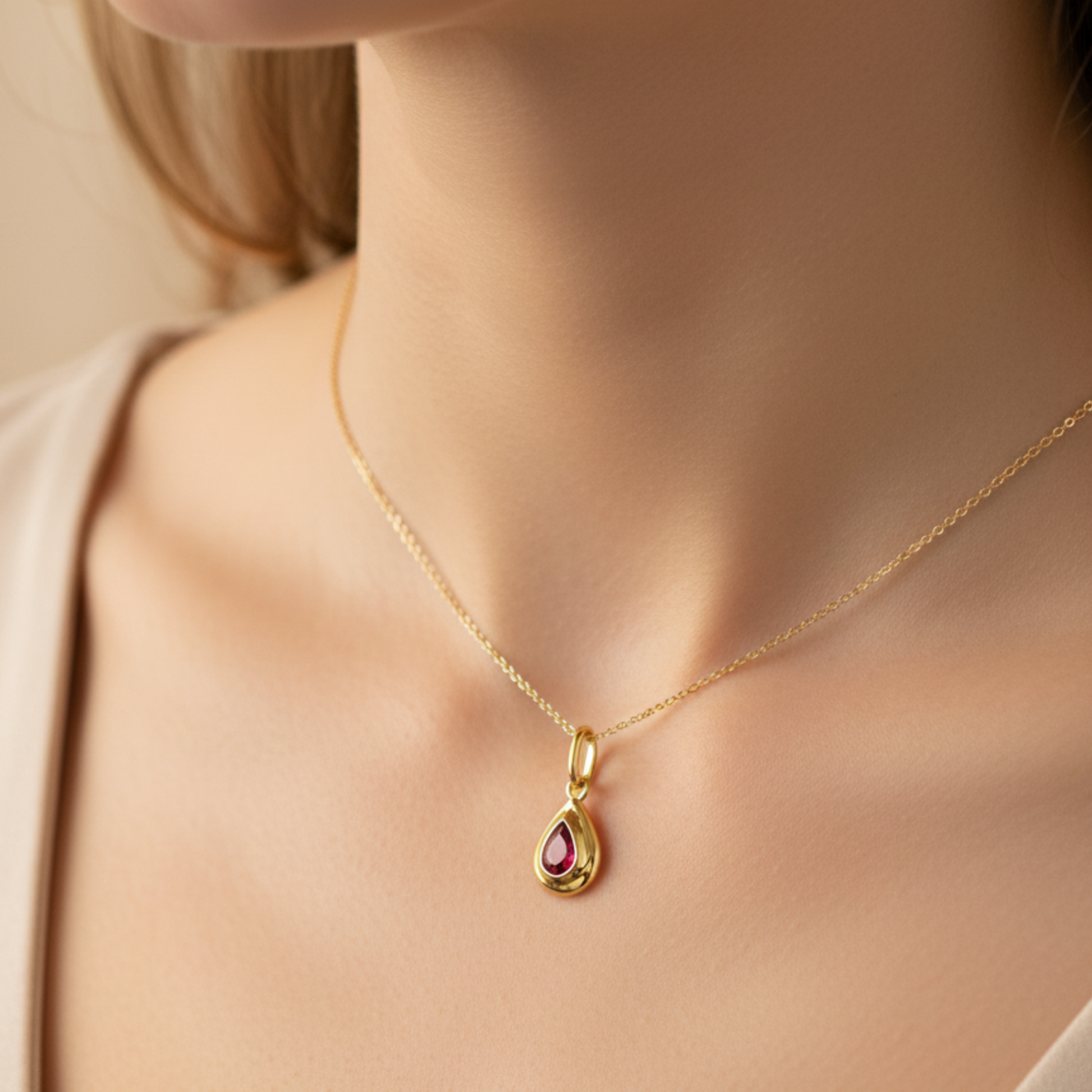 Model Image 1 of KiraKira Ruby Charm | 925 Silver Gold-Plated from Nishani’s Kira Kira festive collection — handcrafted ruby jewelry, charm in gold-plated 925 silver.