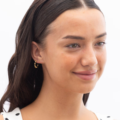 Model Image 1 of Ukiyo Ball Hoops — a minimal, gold-plated 925 silver design crafted for everyday wear from Nishani’s Ukiyo collection.