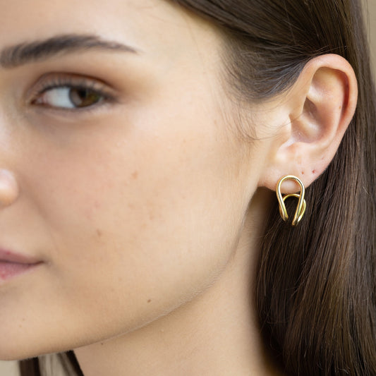 Model Image 1 of Ukiyo Curved Studs — a minimal, gold-plated 925 silver design crafted for everyday wear from Nishani’s Ukiyo collection.