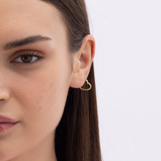 Model Image 1 of Ukiyo Mini Heart Huggies — a minimal, gold-plated 925 silver design crafted for everyday wear from Nishani’s Ukiyo collection.