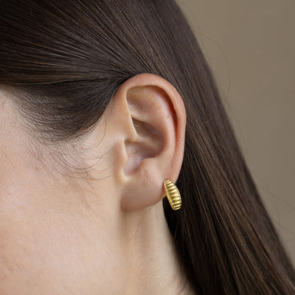 Model Image 1 of Ukiyo Ridges Huggies — a minimal, gold-plated 925 silver design crafted for everyday wear from Nishani’s Ukiyo collection.