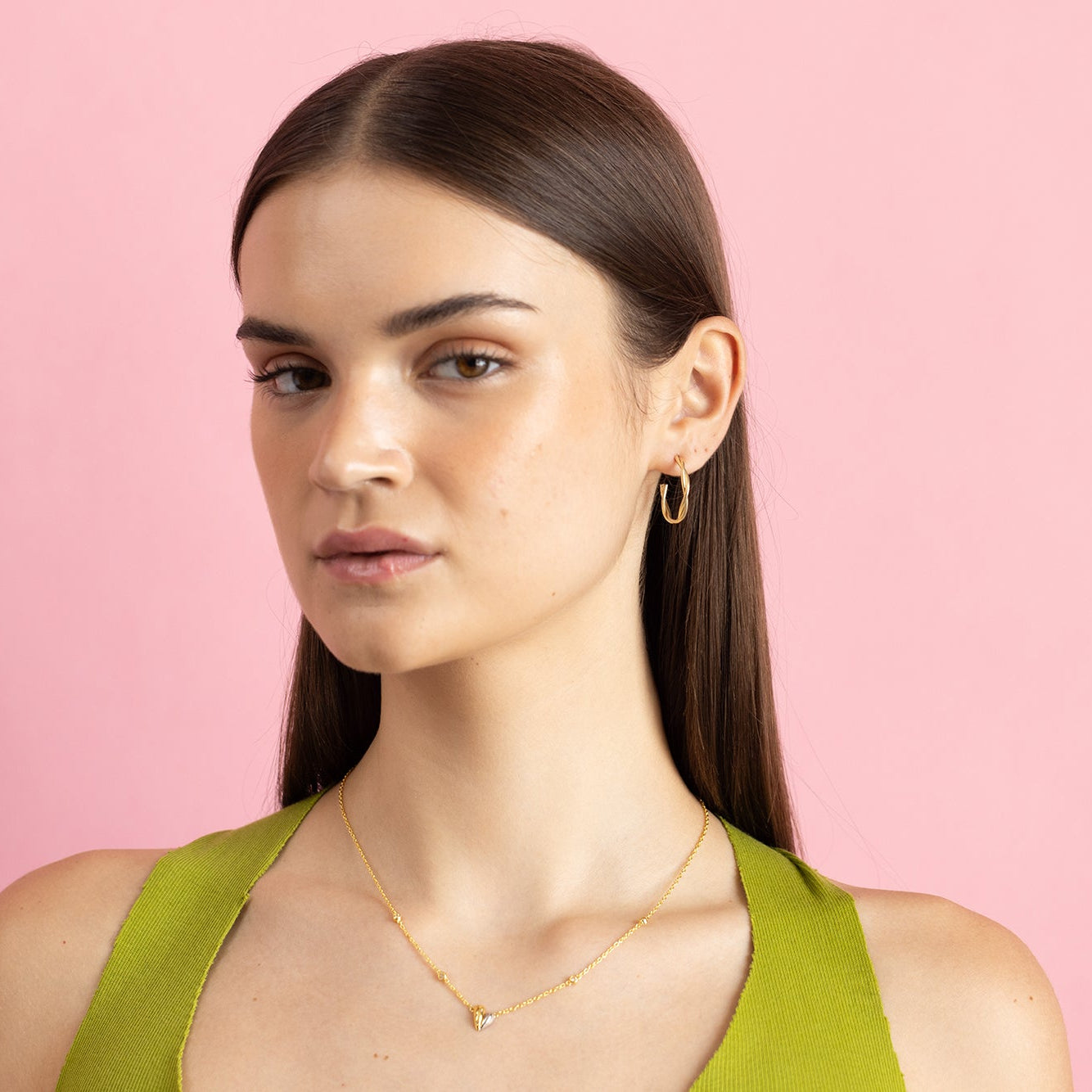 Model Image 1 of Ukiyo twisted Hoops — a minimal, gold-plated 925 silver design crafted for everyday wear from Nishani’s Ukiyo collection.