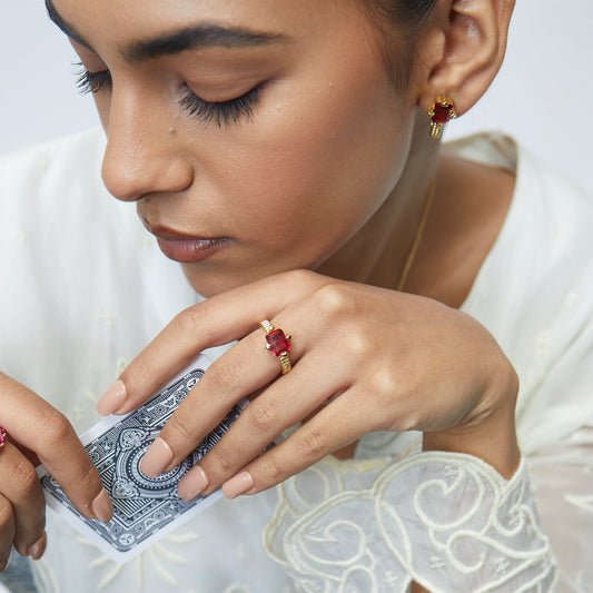 Model Image 2 of KiraKira Ruby Suits Ring | 925 Silver Gold-Plated from Nishani’s Kira Kira festive collection — handcrafted ruby jewelry, ring in gold-plated 925 silver.