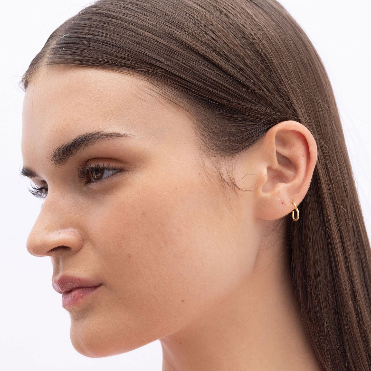 Model Image 3 of Ukiyo Mini Heart Huggies — a minimal, gold-plated 925 silver design crafted for everyday wear from Nishani’s Ukiyo collection.