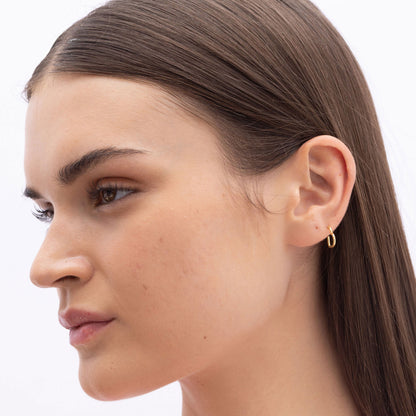 Model Image 3 of Ukiyo Mini Heart Huggies — a minimal, gold-plated 925 silver design crafted for everyday wear from Nishani’s Ukiyo collection.