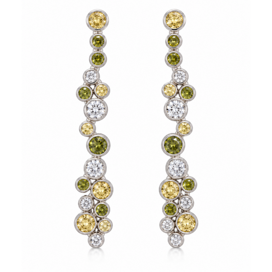 A pair of long, dangling earrings with clusters of round yellow diamonds, green diamonds, and clear diamonds set in silver-toned metal, shown against a plain white background.