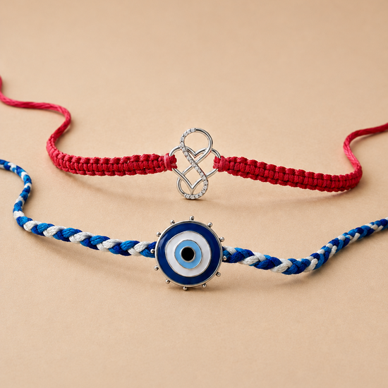 Two braided cord bracelets on a warm beige background. The top bracelet is made of red cord with a silver infinity charm.