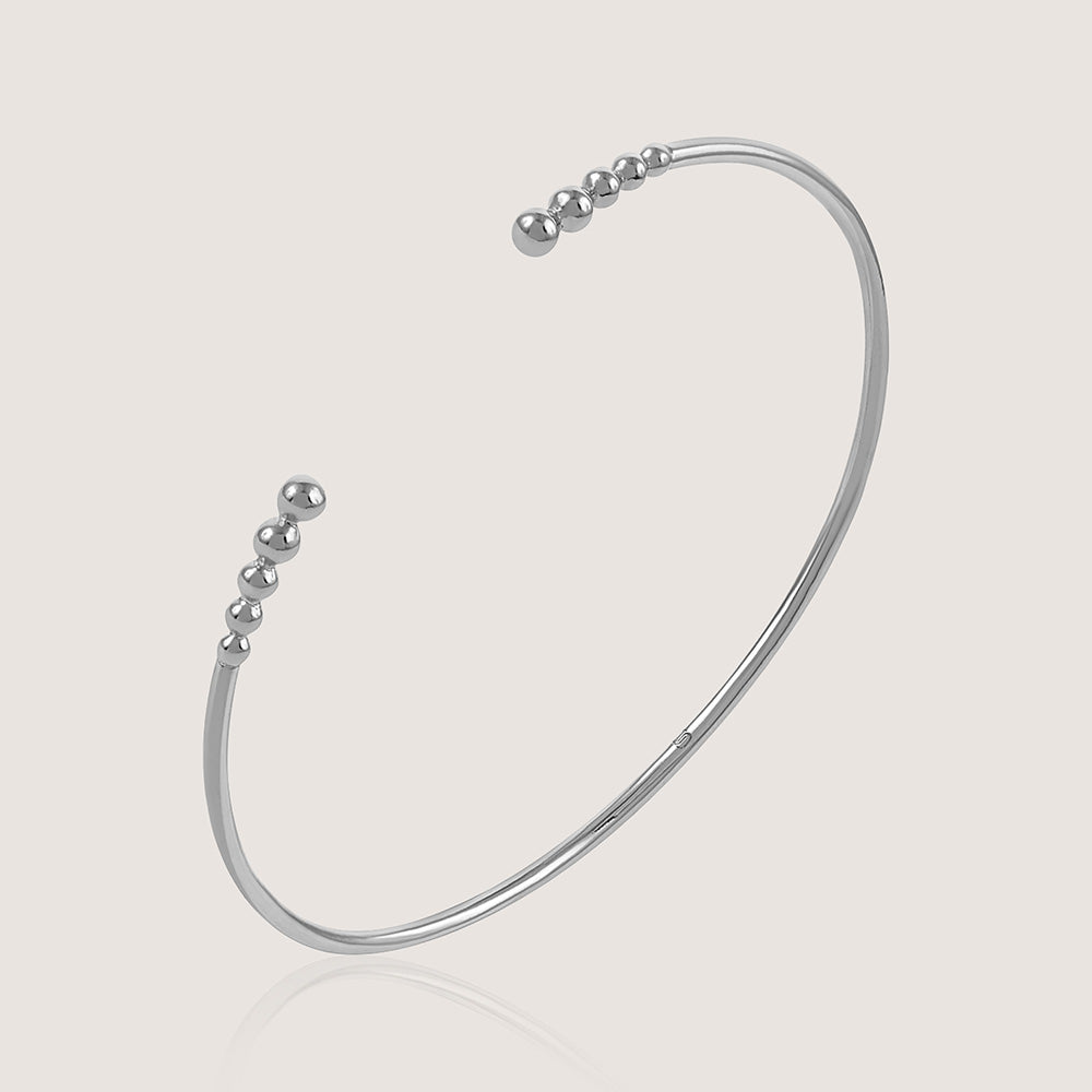 Ukiyo Open Bangle — a minimal, rhodium-plated 925 silver design crafted for everyday wear from Nishani’s Ukiyo collection.