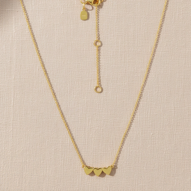 Ukiyo Triple Heart Necklace — a minimal, gold-plated 925 silver design crafted for everyday wear from Nishani’s Ukiyo collection.