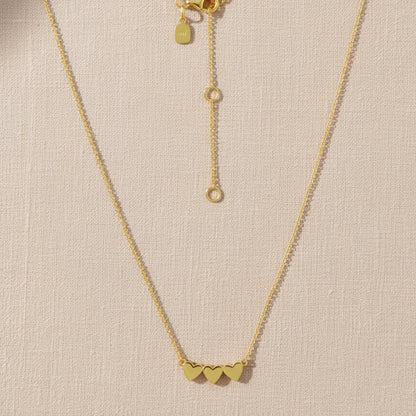 Ukiyo Triple Heart Necklace — a minimal, gold-plated 925 silver design crafted for everyday wear from Nishani’s Ukiyo collection.