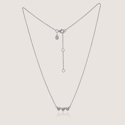 Ukiyo Triple Heart Necklace — a minimal, rhodium-plated 925 silver design crafted for everyday wear from Nishani’s Ukiyo collection.