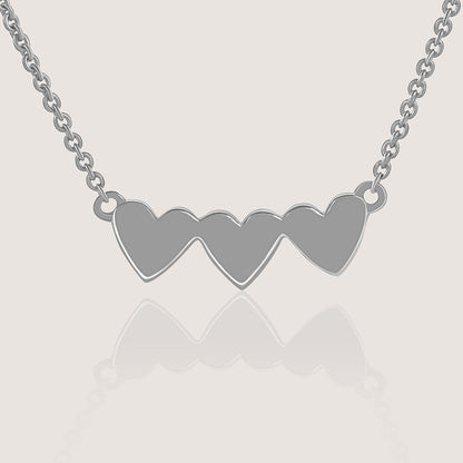Ukiyo Triple Heart Necklace — a minimal, rhodium-plated 925 silver design crafted for everyday wear from Nishani’s Ukiyo collection.