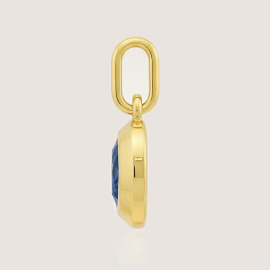 White Background - 2 Side of KiraKira Oval Sapphire Charm | 925 Silver Gold-Plated from Nishani’s Kira Kira festive collection — handcrafted sapphire jewelry, charm in gold-plated 925 silver.